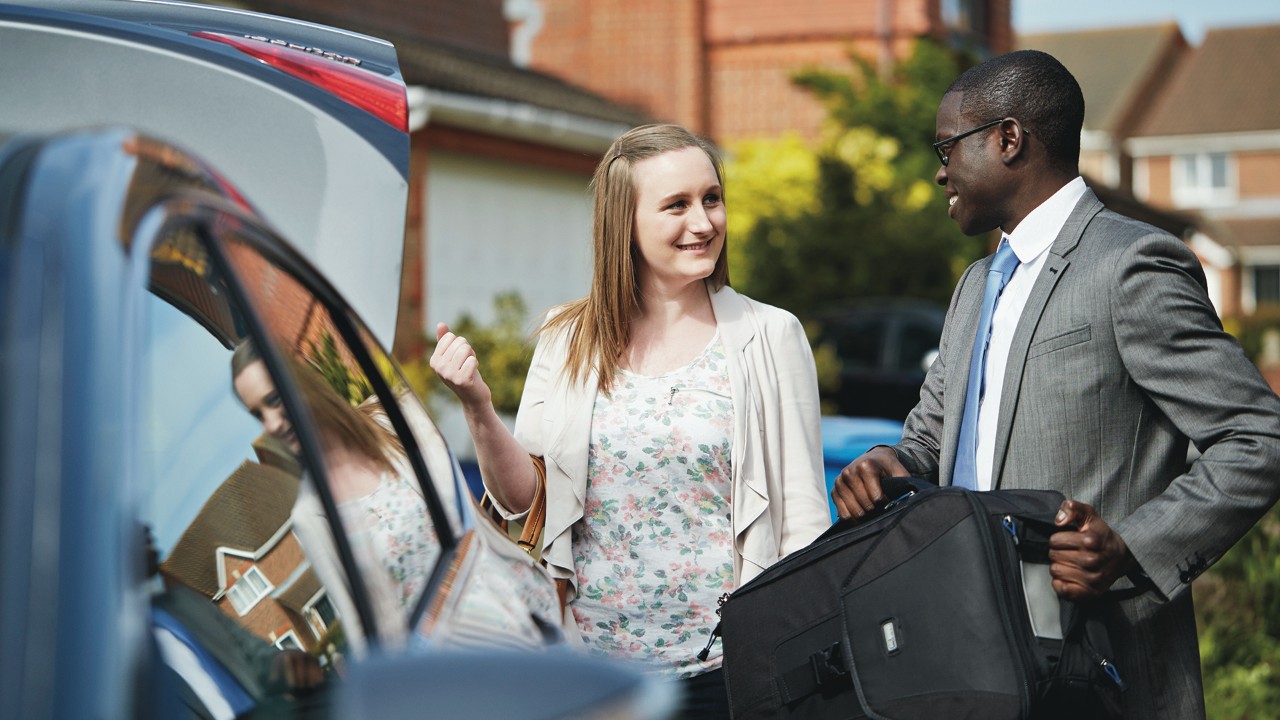 Woman being picked up at home by and Enterprise employee